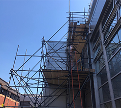 scaffolding around the side of a commercial building